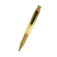 raw brass ballpoint pen with Loclen branded clip on a white background