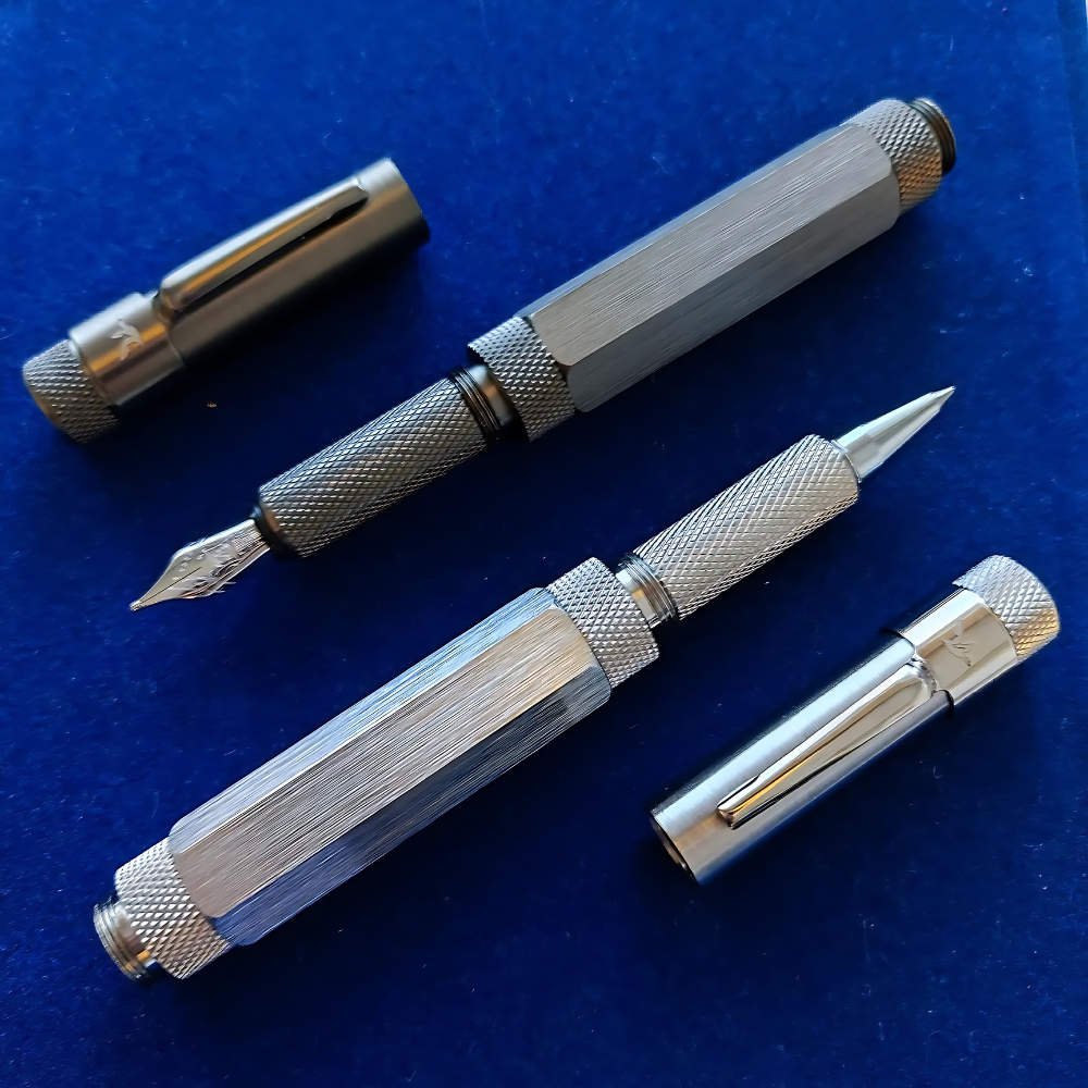 loclen F5 fountain pen in matte black and F5 roller pen in brushed chrome on a velvet blue surface