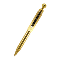 loclen spica ballpoint pen in raw brass on a white background
